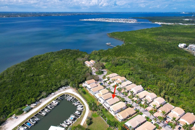 143 Pepper Ln, Jensen Beach, FL 34957 - birds eye view of property with a water view, a view of trees, and a residential view