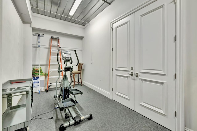 workout area with carpet and baseboards