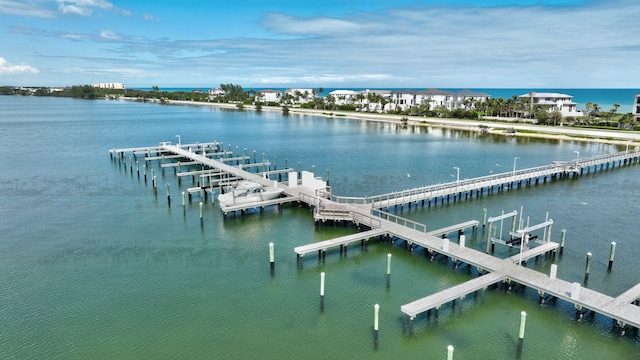 dock area with a water view and boat lift