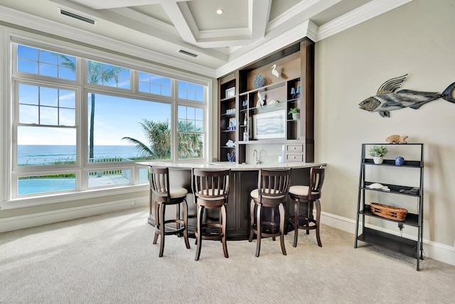 bar with visible vents, ornamental molding, light carpet, wet bar, and coffered ceiling