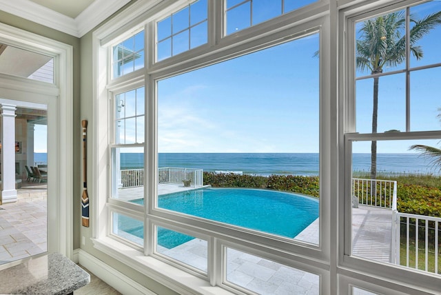 interior space with a water view and ornate columns