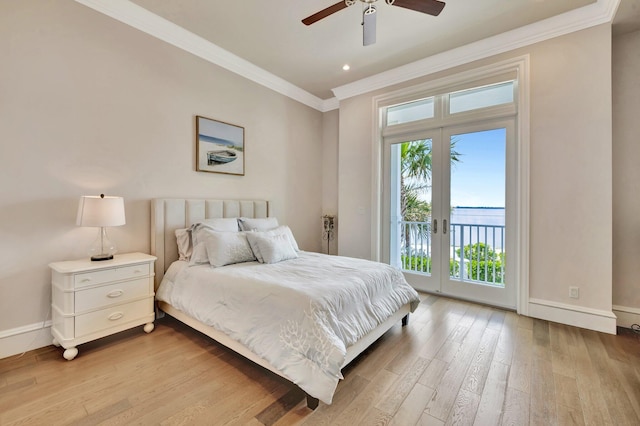 bedroom with wood finished floors, baseboards, access to outside, ornamental molding, and french doors