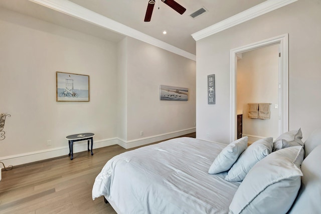 bedroom featuring recessed lighting, wood finished floors, visible vents, baseboards, and crown molding