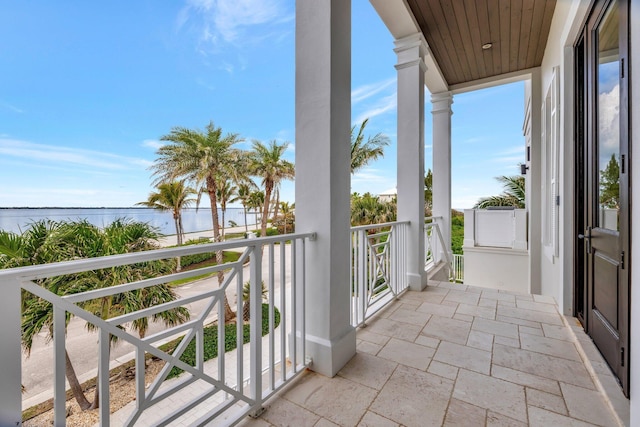 balcony featuring a water view