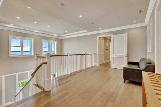 sitting room featuring light wood-style floors, visible vents, ornamental molding, and recessed lighting