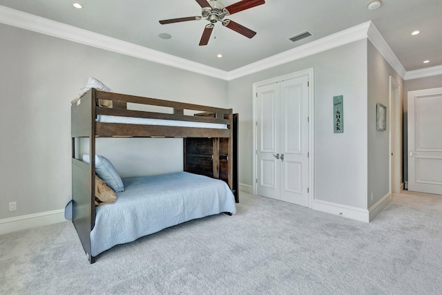 bedroom with recessed lighting, visible vents, baseboards, ornamental molding, and carpet