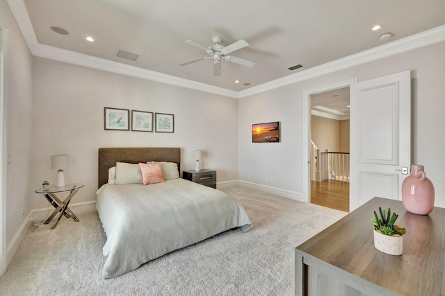 bedroom with carpet floors, baseboards, visible vents, and ornamental molding