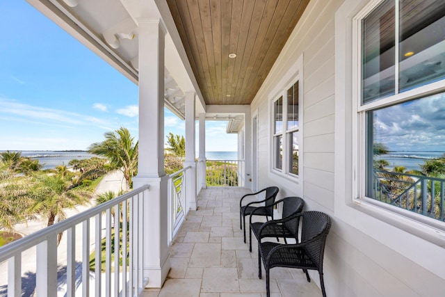 balcony featuring a water view