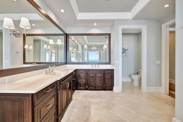 bathroom featuring ornamental molding, vanity, toilet, and baseboards