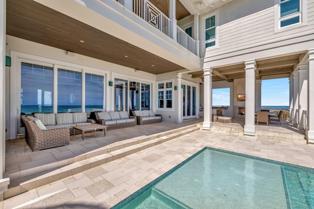 pool with a patio and outdoor lounge area