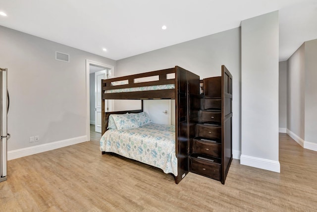 bedroom featuring recessed lighting, baseboards, visible vents, and light wood finished floors