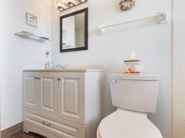 bathroom featuring vanity and toilet