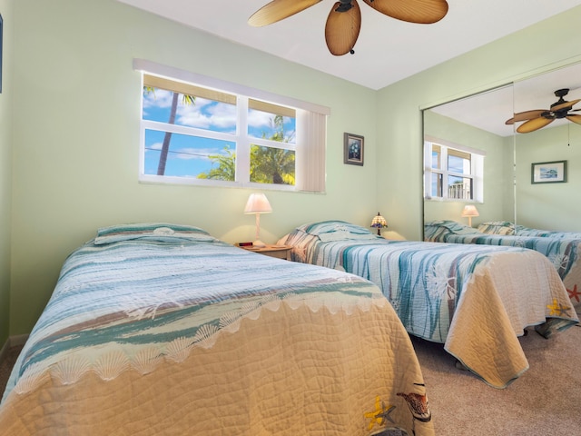 carpeted bedroom with ceiling fan