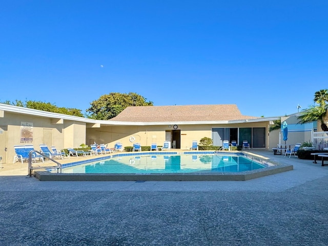 view of swimming pool with a patio