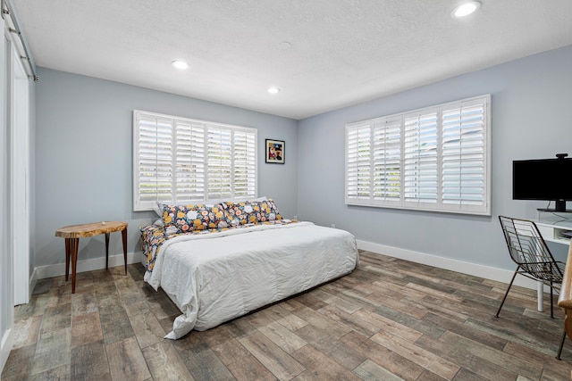 4316 S Ocean Blvd Unit 2S, Highland Beach, FL 33487 - bedroom with wood finished floors, recessed lighting, multiple windows, and baseboards