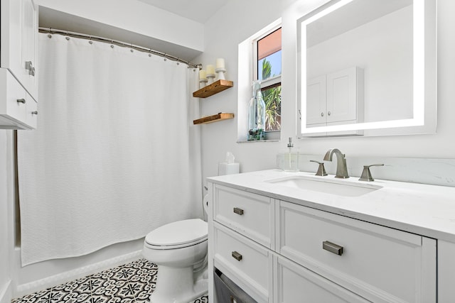 4316 S Ocean Blvd Unit 2S, Highland Beach, FL 33487 - bathroom featuring toilet, vanity, and tile patterned flooring