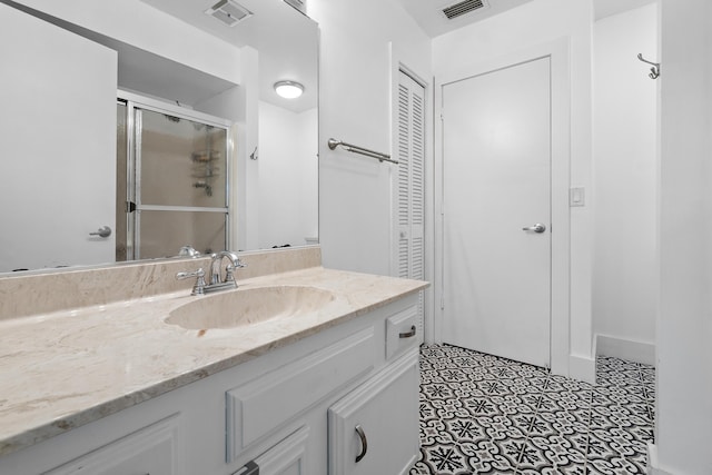 4316 S Ocean Blvd Unit 2S, Highland Beach, FL 33487 - bathroom featuring vanity, a stall shower, and a closet