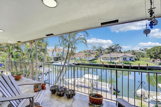 balcony featuring a water view