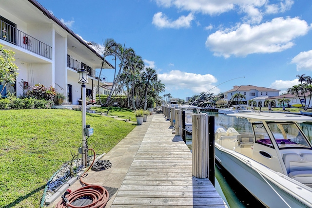 4316 S Ocean Blvd Unit 2S, Highland Beach, FL 33487 - dock featuring a lawn