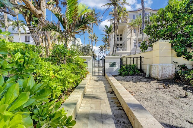 dock area with a water view and a yard