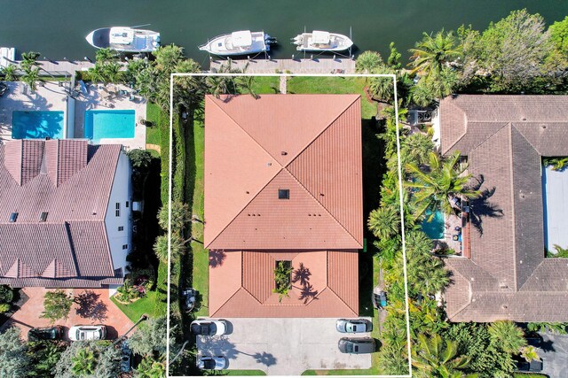 birds eye view of property with a water view