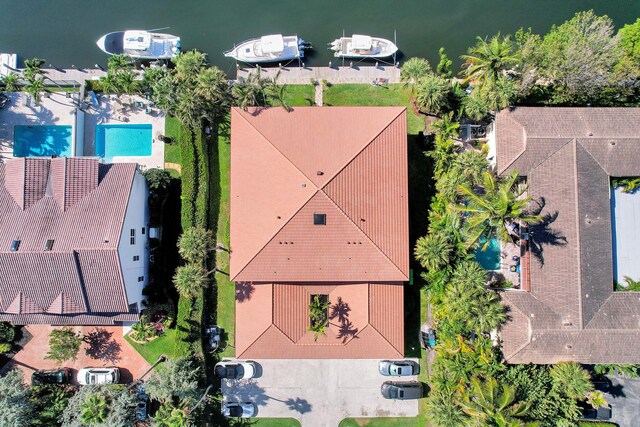 birds eye view of property with a water view