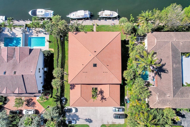 birds eye view of property featuring a water view