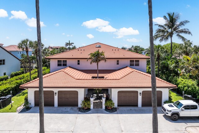 4316 S Ocean Blvd Unit 2S, Highland Beach, FL 33487 - mediterranean / spanish-style house featuring stucco siding, driveway, and a tiled roof