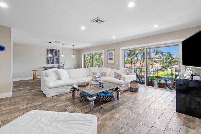 4316 S Ocean Blvd Unit 2S, Highland Beach, FL 33487 - living room featuring wood finished floors, baseboards, and recessed lighting