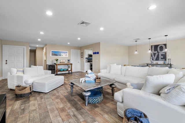 4316 S Ocean Blvd Unit 2S, Highland Beach, FL 33487 - living room featuring wood finished floors, recessed lighting, wine cooler, and baseboards
