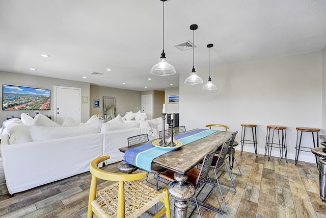 dining space featuring hardwood / wood-style floors