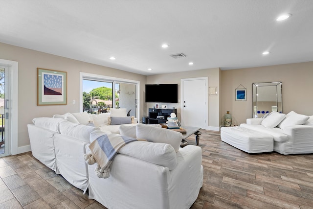 4316 S Ocean Blvd Unit 2S, Highland Beach, FL 33487 - living area featuring wood finished floors, recessed lighting, and baseboards