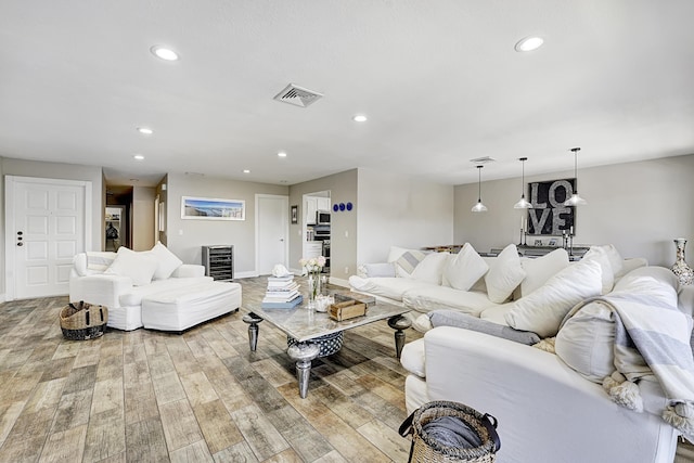 living room with light hardwood / wood-style flooring