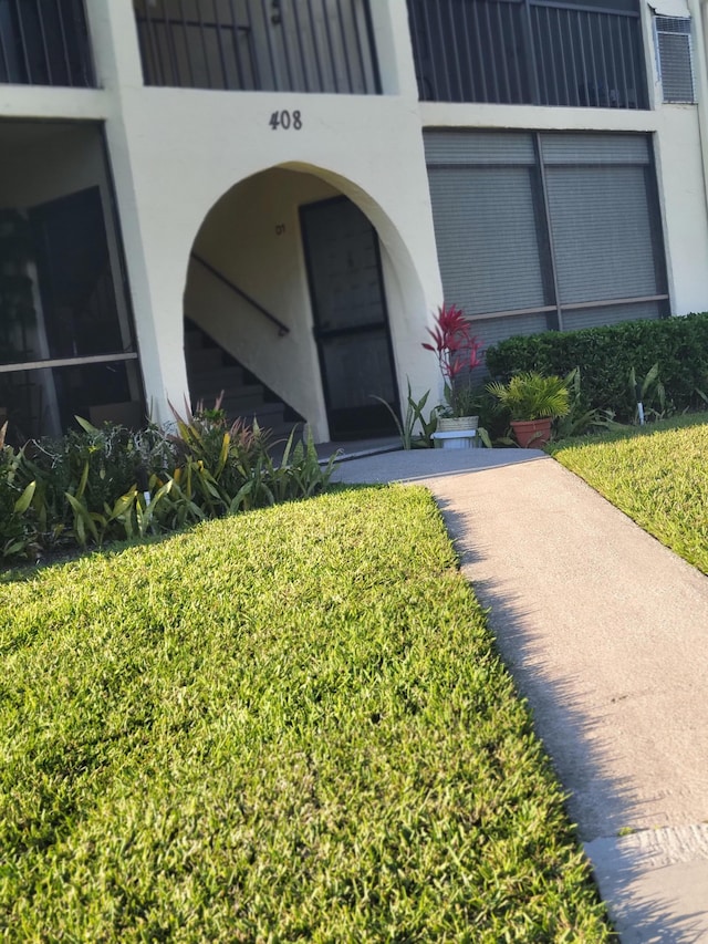 property entrance with stucco siding