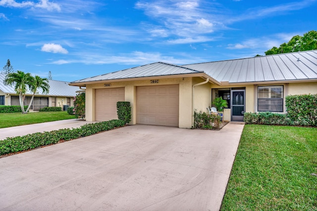 ranch-style house with a garage and a front lawn