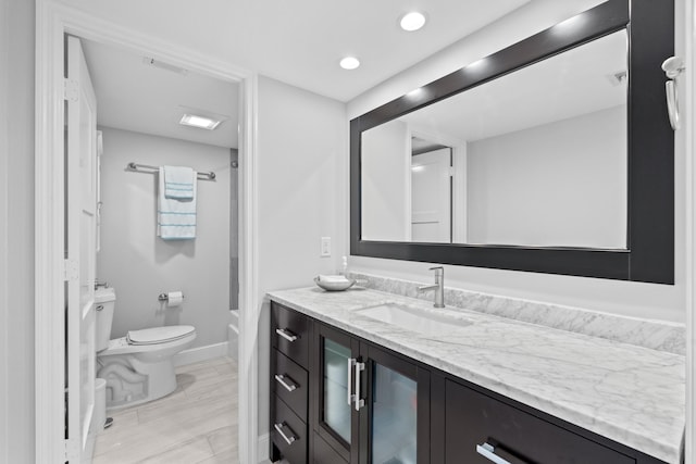 full bath with toilet, recessed lighting, vanity, baseboards, and shower / bathing tub combination