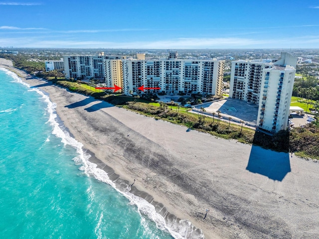 bird's eye view with a beach view, a view of city, and a water view