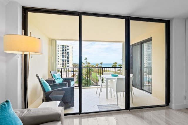 doorway to outside featuring floor to ceiling windows