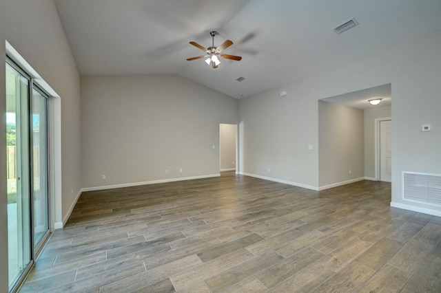 spare room featuring lofted ceiling, hardwood / wood-style floors, and ceiling fan