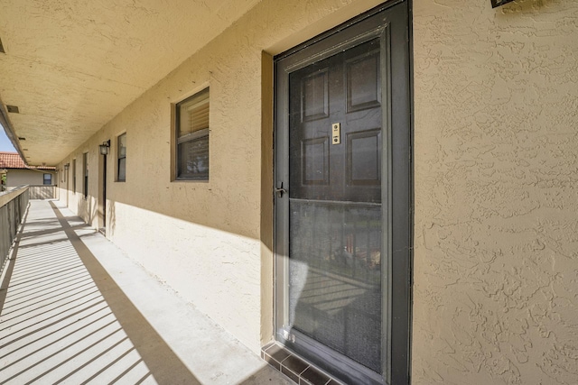 doorway to property featuring a balcony