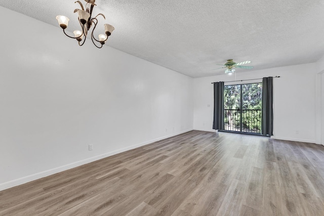 21894 Lake Forest Cir Unit 204, Boca Raton, FL 33433 - spare room featuring ceiling fan with notable chandelier, light hardwood / wood-style floors, and a textured ceiling