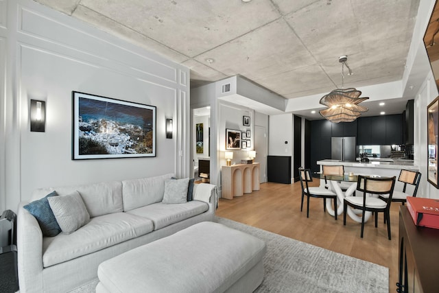 living room with light hardwood / wood-style flooring