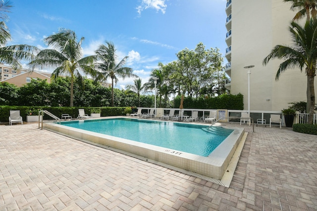 view of pool featuring a patio