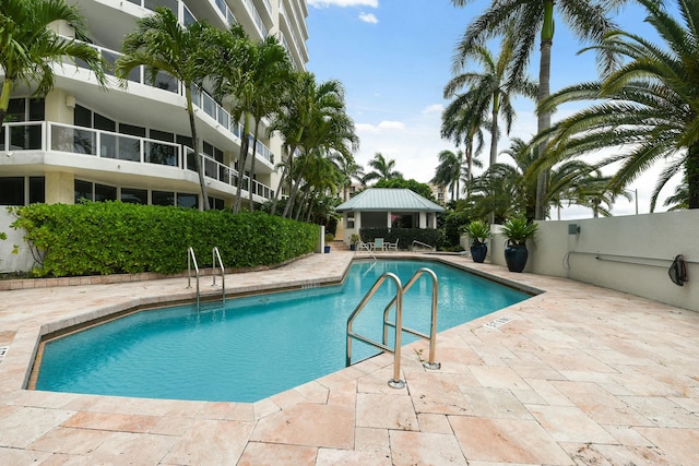 view of swimming pool with a gazebo and a patio area