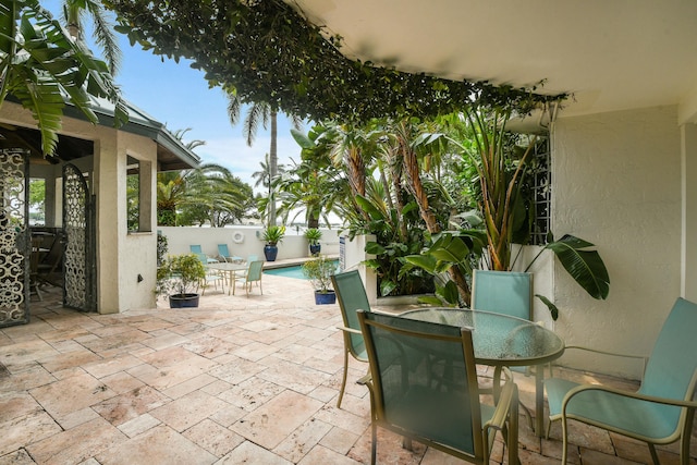 view of patio / terrace with a fenced in pool