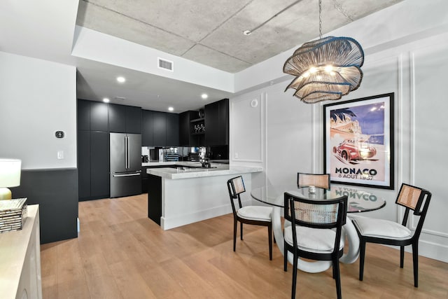 dining room with light hardwood / wood-style floors