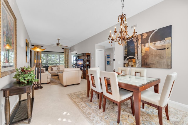 dining area with light tile patterned flooring, baseboards, and ceiling fan with notable chandelier