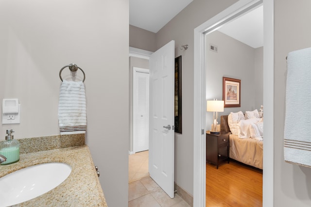 bathroom with vanity and tile patterned floors