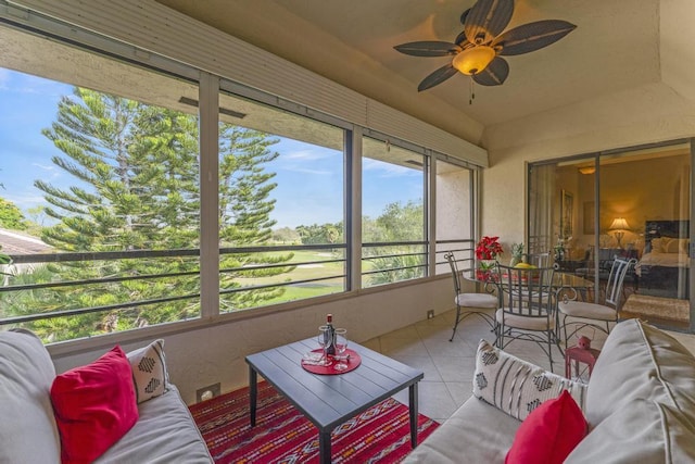 sunroom / solarium featuring ceiling fan