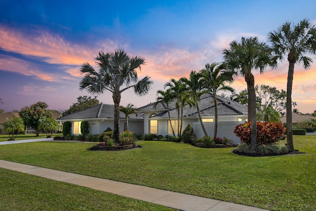 view of front of home with a yard